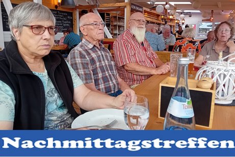 Symbolbild des Nachmittagstreffen zeigt Personen an den Tischen