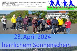 Bild zeigt die Nordic Walkinggruppe bei Sonnenschein in bunden Jacken