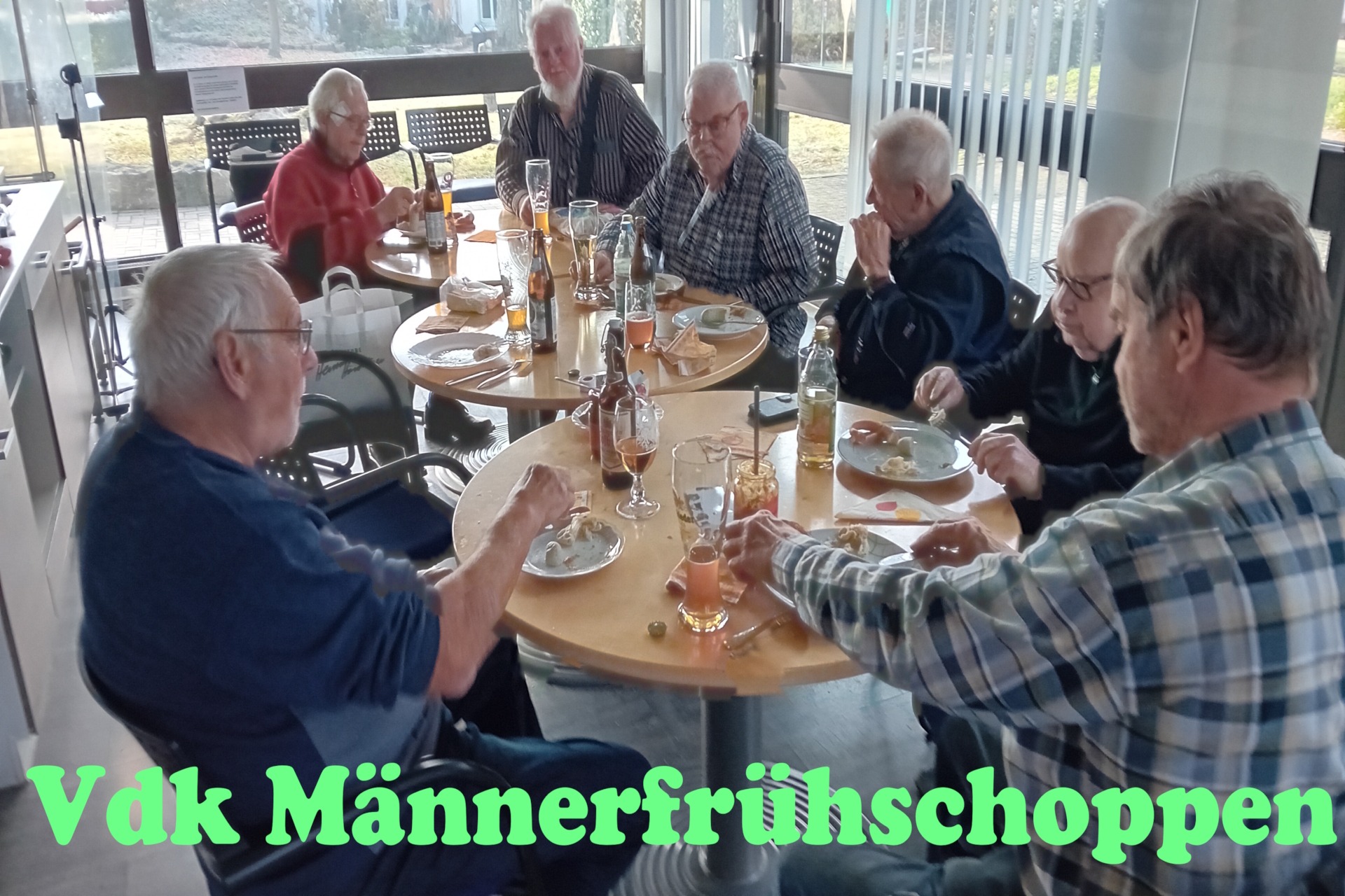 Bild zeigt Männer beim Weisswurstessen